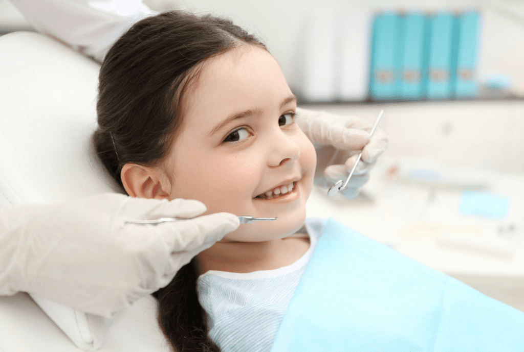 A girl smiling during her dental checkup