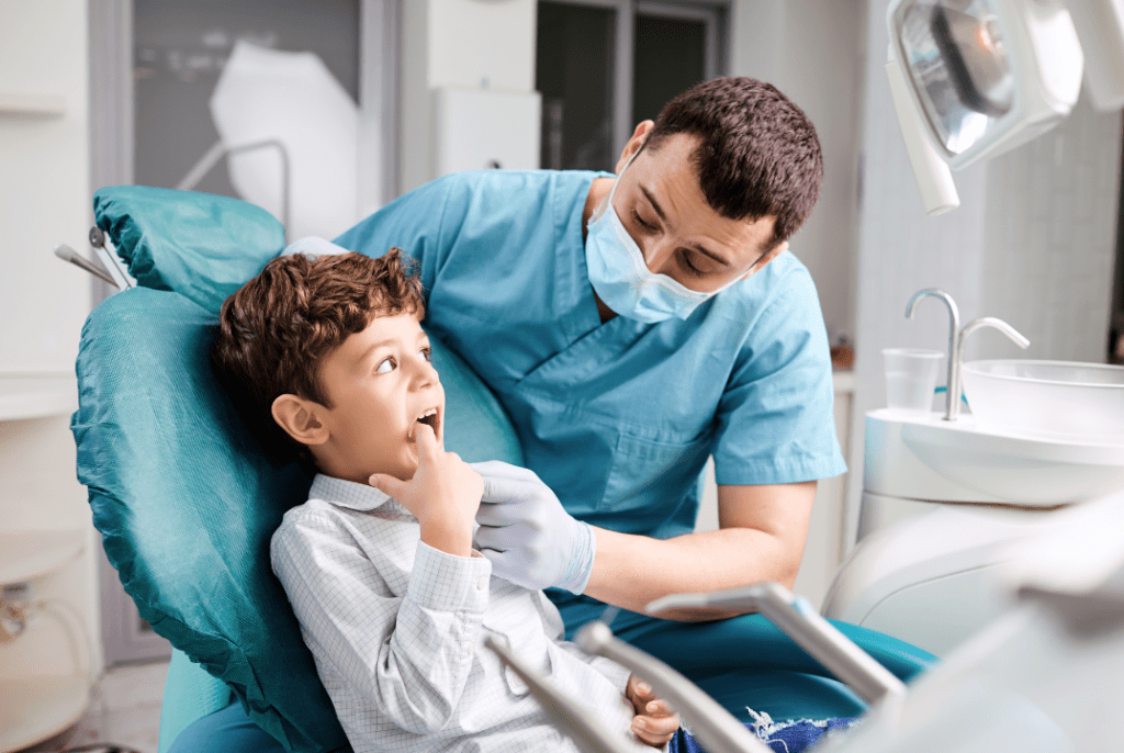 A dentist checking a child’s teeth in a dental clinic